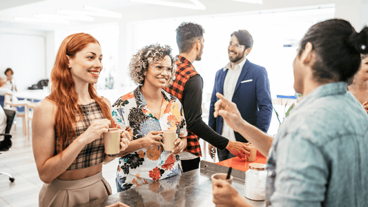 A group of happy customers enjoying a casual networking coffee break at a Miami restaurant, reflecting the community-focused atmosphere that a Miami content marketing agency can promote.